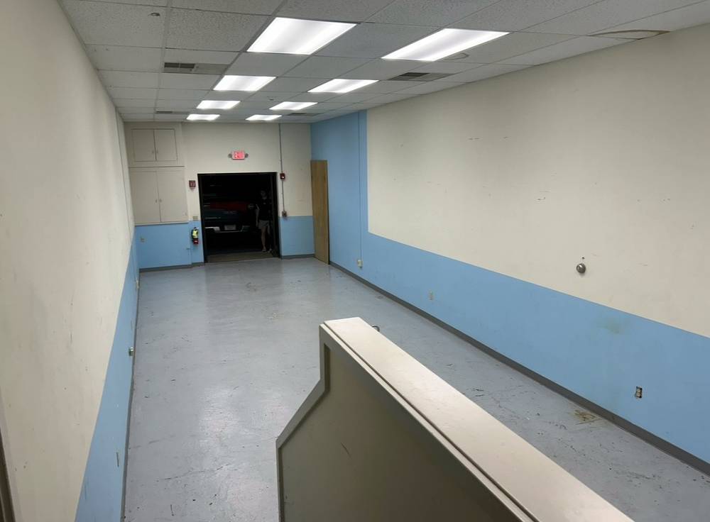 The same room swept and completely empty after Junkaroos hauled everything away